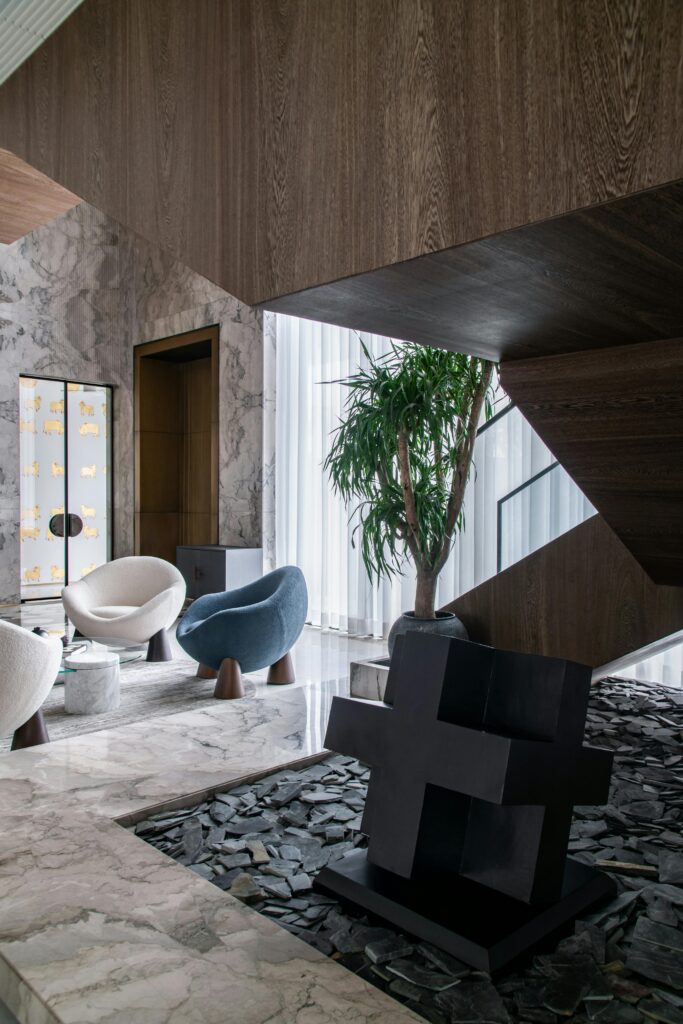 Stylish living space featuring contemporary furniture and marble textures.